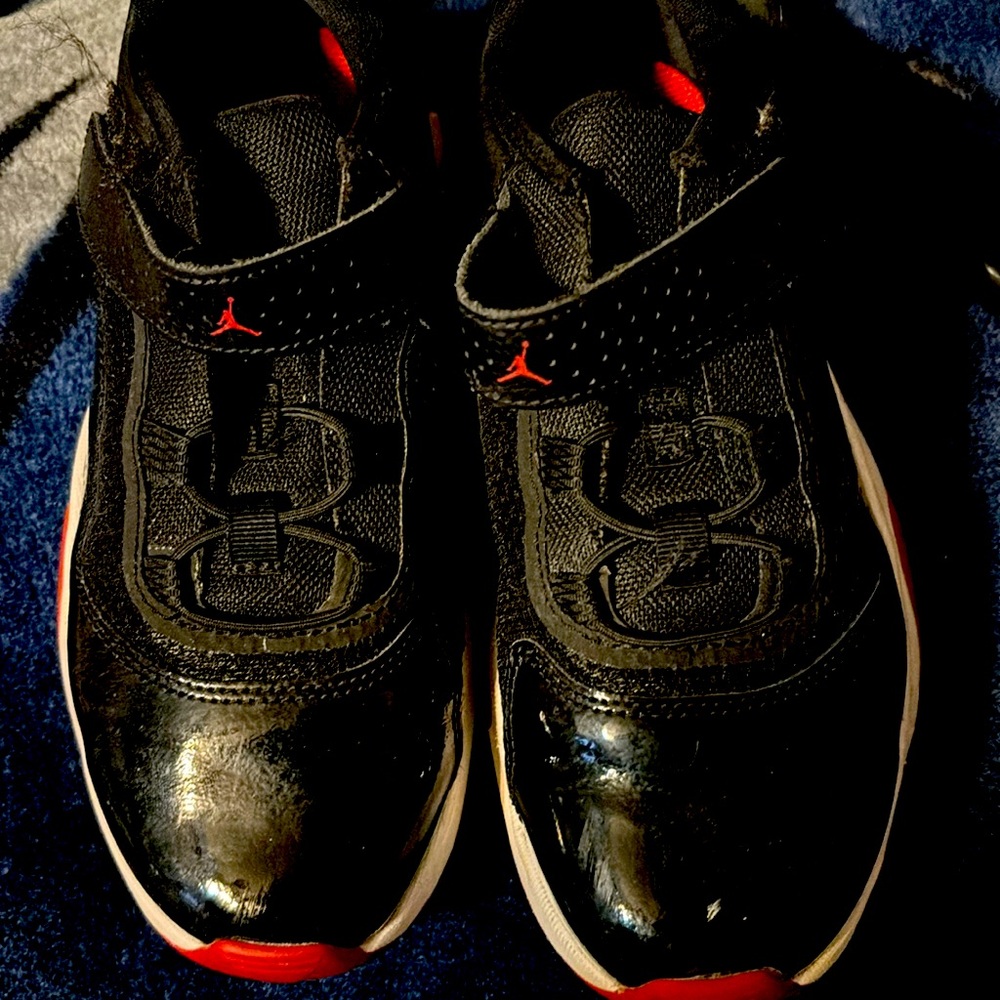 Black, white, red Jordan’s. Worn once